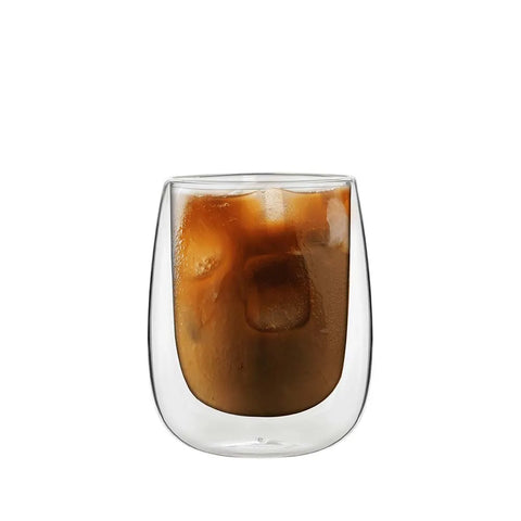 Clear glass with iced coffee on a white background