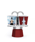 Double espresso cup holder with two cups featuring rocket designs on a white background