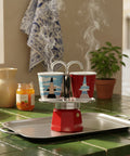 Double espresso cup holder with two cups featuring architectural designs on a white background