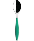 Spoon with a green handle on a white background