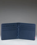 A dark navy blue bifold wallet shown open against a gradient gray studio background.