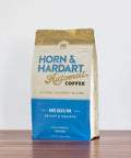 Horn & Hardart coffee bag on a wooden surface with a white background