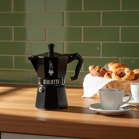 Black Bialetti coffee maker on a white background